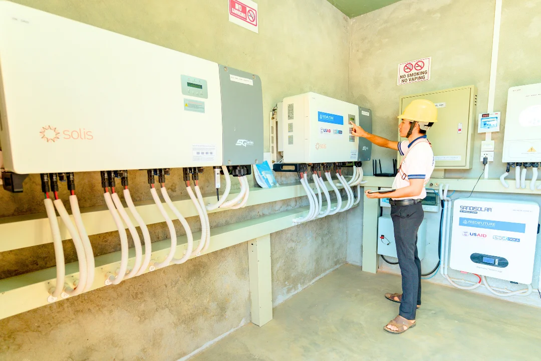Solar inverter room with worker checking equipment