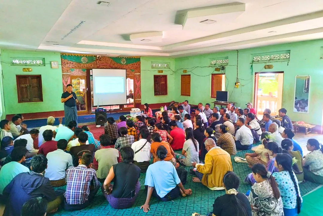 Large farmer training session in community hall
