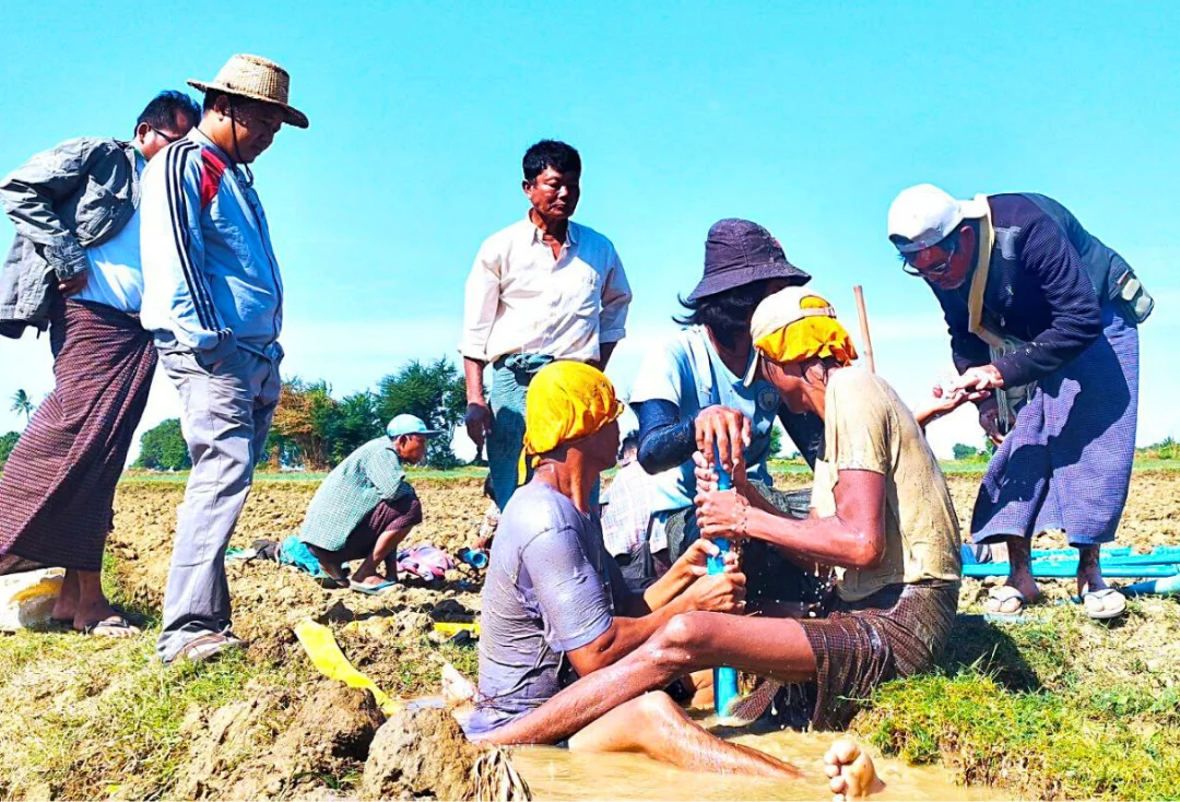 Farmers and staff at irrigation field site