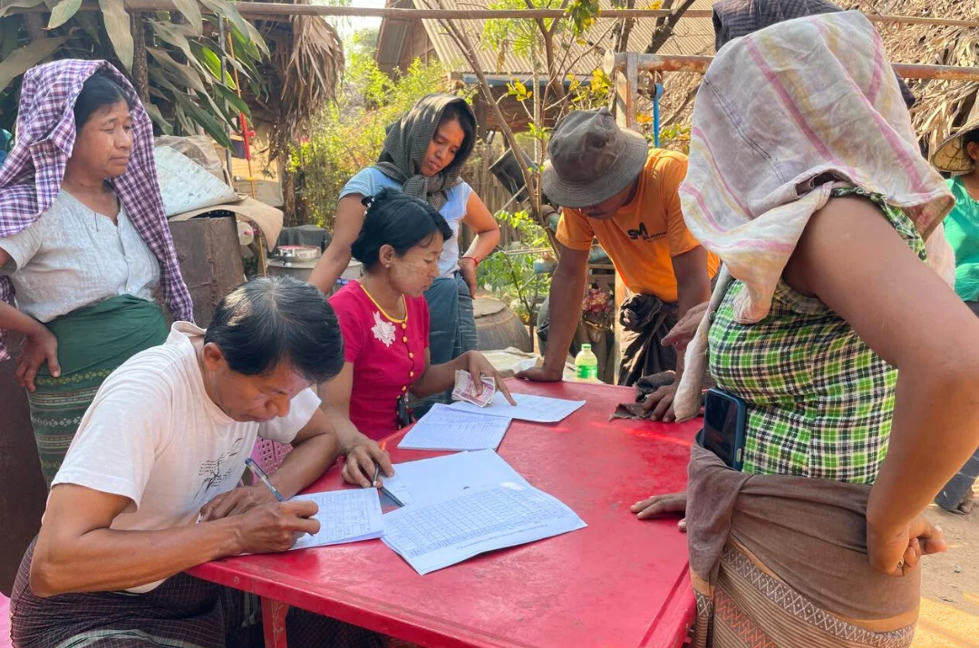 Farmers signing contract farming agreements