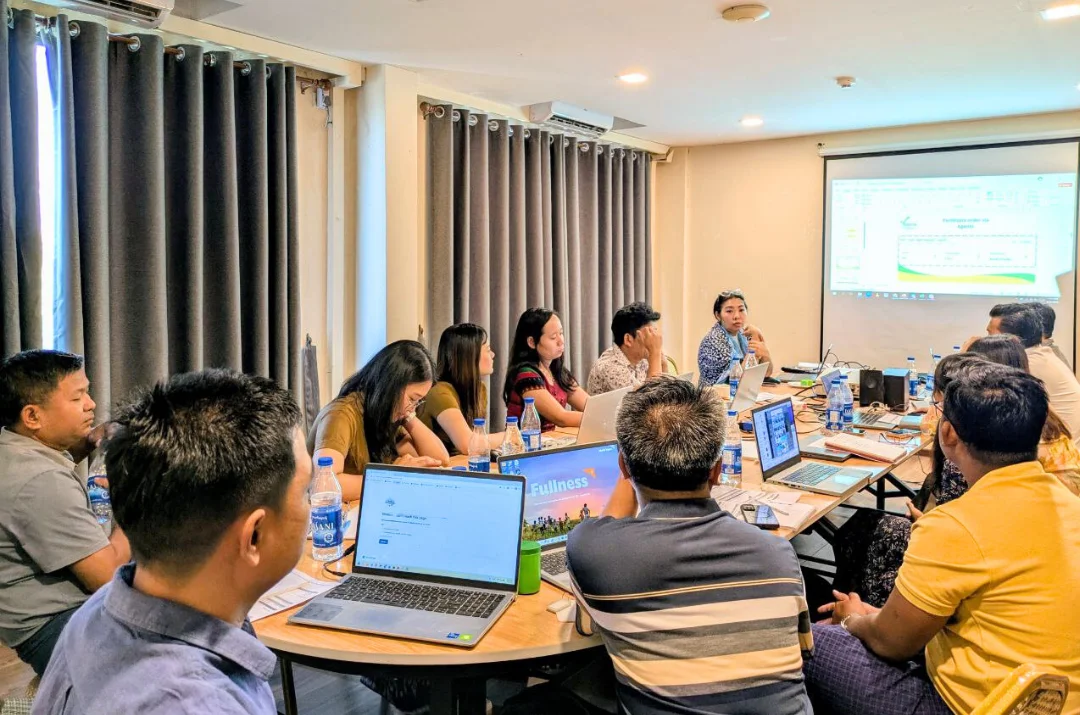 Team meeting with laptops and projector